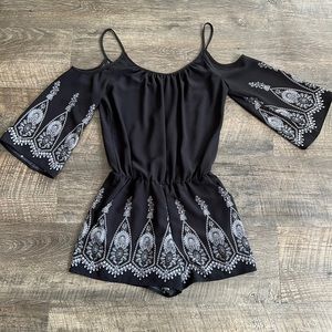 Bisou Bisou black romper with shoulders cut out